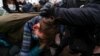 Police detain a protester in Moscow.