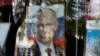 Портрет президента России Владимира Путина в окне магазина. Крым, Симферополь, октябрь 2014 года