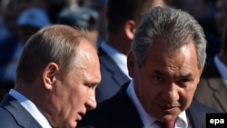 Russian President Vladimir Putin (left) and Defense Minister Sergei Shoigu