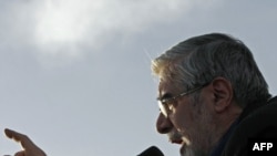 Defeated presidential candidate Mir Hossein Musavi addresses his supporters during a pre-election rally.