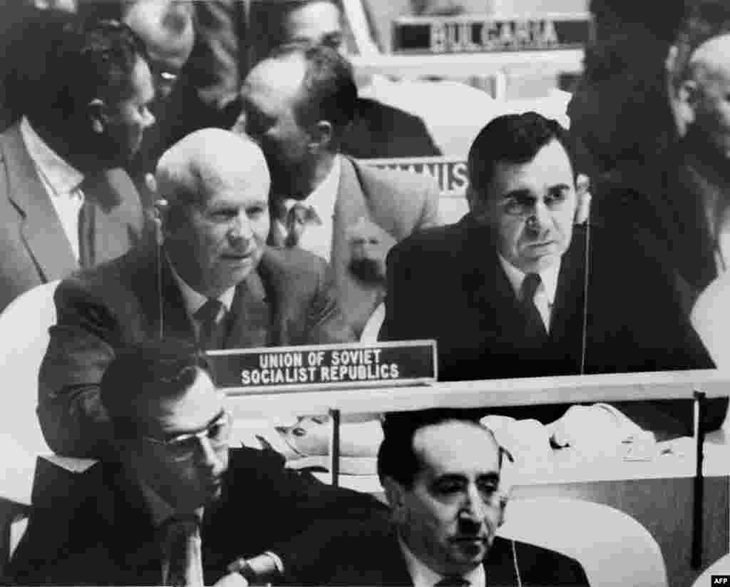 Khrushchev rests his shoe on his desk at the United Nations in New York on October 12, 1960. Moments before, he had banged his shoe on the desk while denouncing the Philippine delegate, Lorenzo Sumulong, for accusing the Soviet Union of imperialism in Eastern Europe.