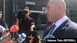 Outgoing Kosovar Prime Minister Ramush Haradinaj speaks to reporters outside a special court in The Hague on July 24. 