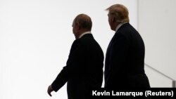 Владимир Путин и Дональд Трамп на встрече в Осаке, 28 июня 2019 года 