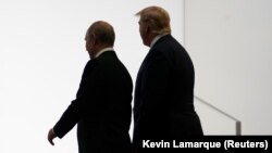 Владимир Путин и Дональд Трамп на встрече в Осаке, 28 июня 2019 года. 