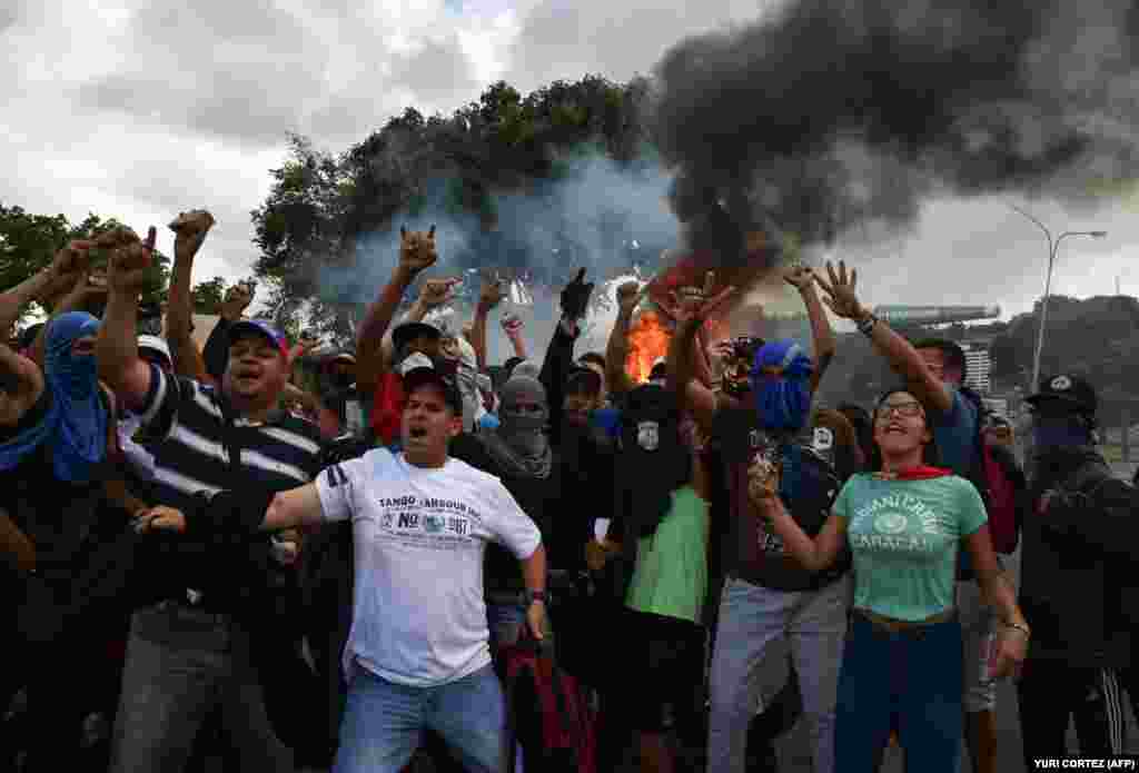 Opposition demonstrators chant slogans in Caracas. 