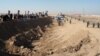 Demonstrators protest outside Camp Ashraf near the Iranian border in December 2011.