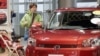 Жапония - Кардар Toyota Motor's компаниясында Corolla Rumion автоунаасын текшерүүдө. (Жапония дүйнөдө ажыдаар деген атка конгон алгачкы өлкө.)