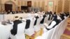 Taliban negotiators and Qatari officials meet in Doha in March 2019.