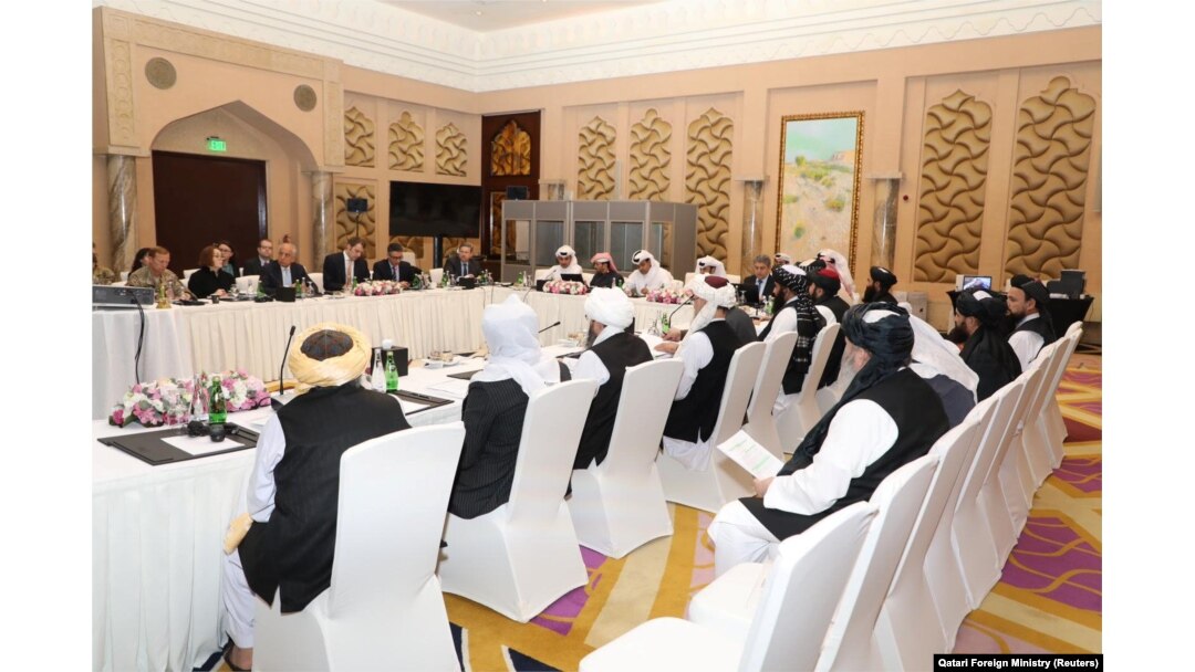 Taliban negotiators and Qatari officials meet in Doha in March 2019.