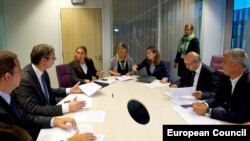 The EU's Federica Mogherini (center) meets with Kosovar Prime Minister Isa Mustafa (second from right) and Serbian Prime Minister Aleksandar Vucic (second from left) in Brussels on August 25.