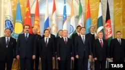 Russia -- Participants pose for a photo at a meeting of the Shanghai Cooperation Organisation in St. Petersburg, 07Nov2011