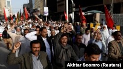 FILE: Journalists and activists protests in Karachi in February.