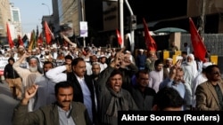 FILE: Journalists chant slogans during a protest rally in the southern city of Karachi in February.