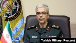 IRAN -- FILE PHOTO -- Iranian Military Chief of Staff General Mohammad Baqeri meets with Turkish Chief of Staff General Hulusi Akar (not seen) in Tehran, Iran October 2, 2017.