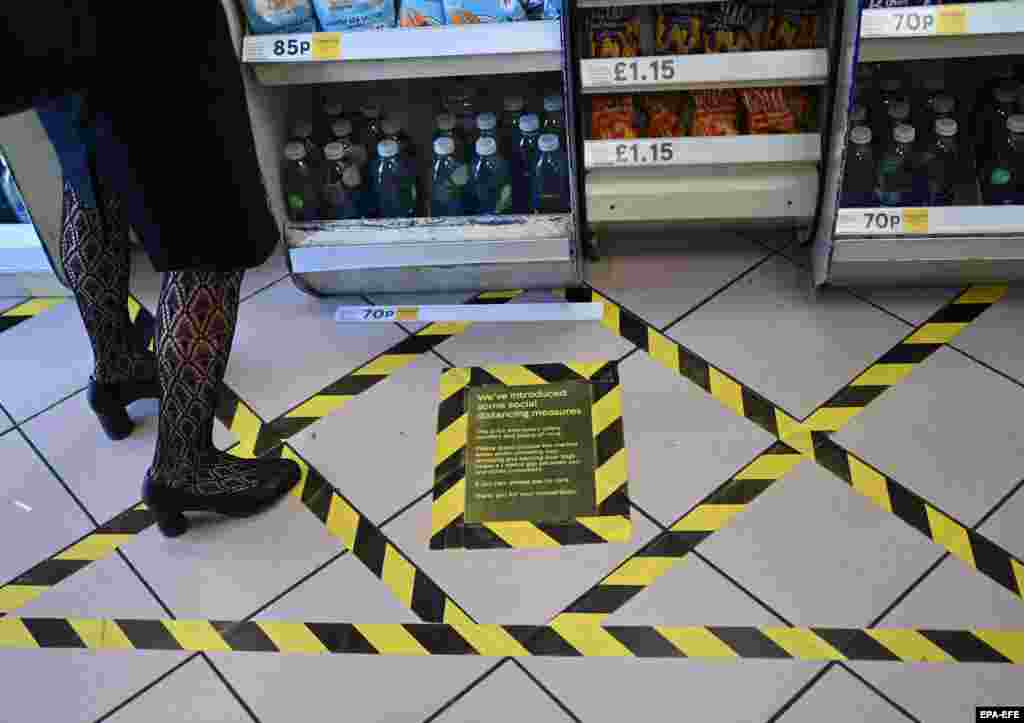 Social-distancing measures at a Tesco grocery store in London on March 24