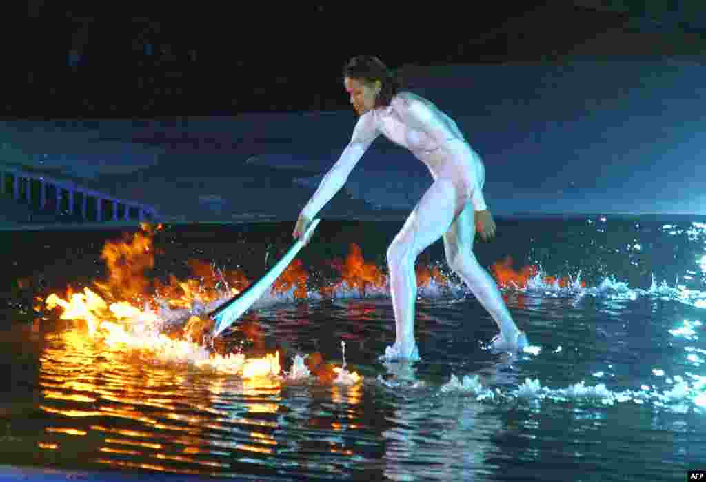 Australian aborigine athlete Cathy Freeman lights the Olympic cauldron in Sydney in September 2000.