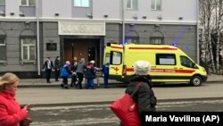 An ambulance takes away a casualty after an explosion at the entrance of an FSB office in the city of Arkhangelsk, in northern Russia, on October 31.