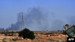 The Red Cross says the situation in Sirte is "dire" as fighting between interim forces and Qaddafi backers rages.