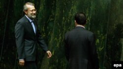 Ali Larijani makes his way to the podium after being elected as interim parliament speaker in Tehran on May 29.