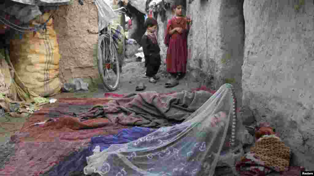 An internally displaced child sleeps at a refugee camp in Kabul, Afghanistan. (REUTERS/Mohammad Ismail)