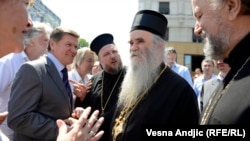 At a rally in Belgrade on May 10 against a normalization deal between Serbia and Kosovo, Bishop Atanasije (second from right) compared Prime Minister Ivica Dacic to former Prime Minister Zoran Djindjic, who was assassinated in 2003.