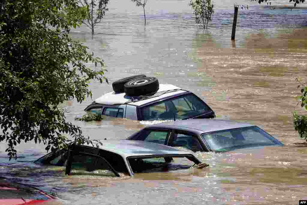 Sunken vehicles in the flooded village of Gunja, eastern Croatia