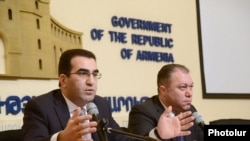 Armenia - Deputy Minister of Economy Garegin Melkonian (L) at a press conference in Yerevan, 18Feb2014.