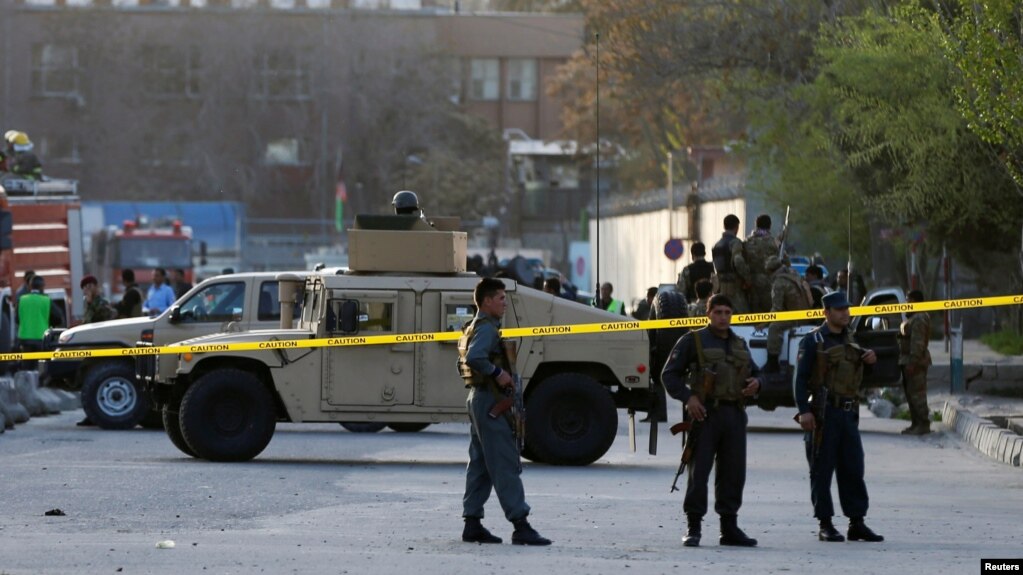 Afghan policemen seal off the site of a suicide bombing in Kabul on April 12.