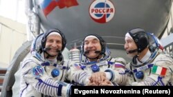 NASA's Andrew Morgan, cosmonaut Aleksandr Skvortsov, and Italian Luca Parmitano prior to their July 20 launch.