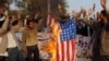 Pakistan - Students supporters of Islami Jamiat Taliba burn an US flag in Multan, 17Jan2007