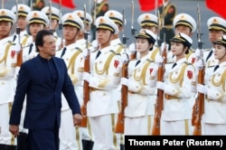 Then-Pakistani Prime Minister Imran Khan reviews a guard of honor during a welcome ceremony in Beijing during a visit to China in 2019.