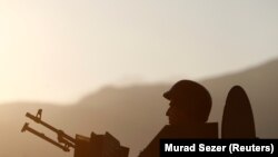 File photo:TURKEY -- A Turkish soldier is seen in an armoured personnel carrier (APC) at a check point near the Turkish-Syrian border in Kilis province, Turkey, January 29, 2018