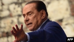 Italy -- Former Prime Minister Silvio Berlusconi delivers a speech during a rally organised by the People of Freedom party (PDL) against 'politicised magistrates' in Brescia, 11May2013