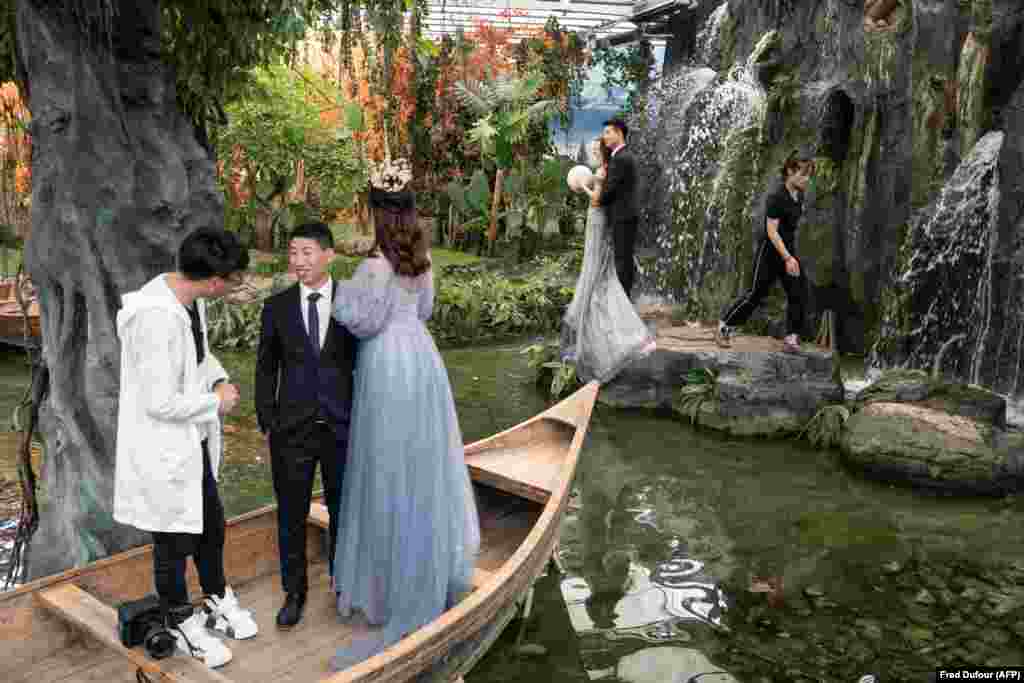In China today, entire businesses -- like Rome Studio (pictured) in Beijing -- are dedicated to faking exotic locations for wedding photos. In the United States in 2018, a Los Angeles artist created a set that imitated the interior of a private jet. The artist proved little has changed except modes of transport when he said, &quot;Most people cannot afford a real jet, so we made one that democratizes access to a backdrop previously reserved for the rich and famous.&quot;