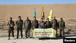 Syrian Democratic Forces commanders attend a news conference in Ain Issa to announce their decision to launch a campaign to retake the Syrian town of Raqqa from Islamic State. 