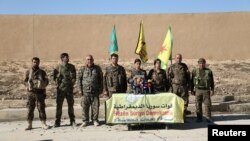 Syrian Democratic Forces commanders attend a news conference in Ain Issa to announce their decision to launch a campaign to retake the Syrian town of Raqqa from Islamic State.