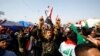 Iraqi demonstrators chant slogans during ongoing anti-government protests in Najaf, February 6, 2020