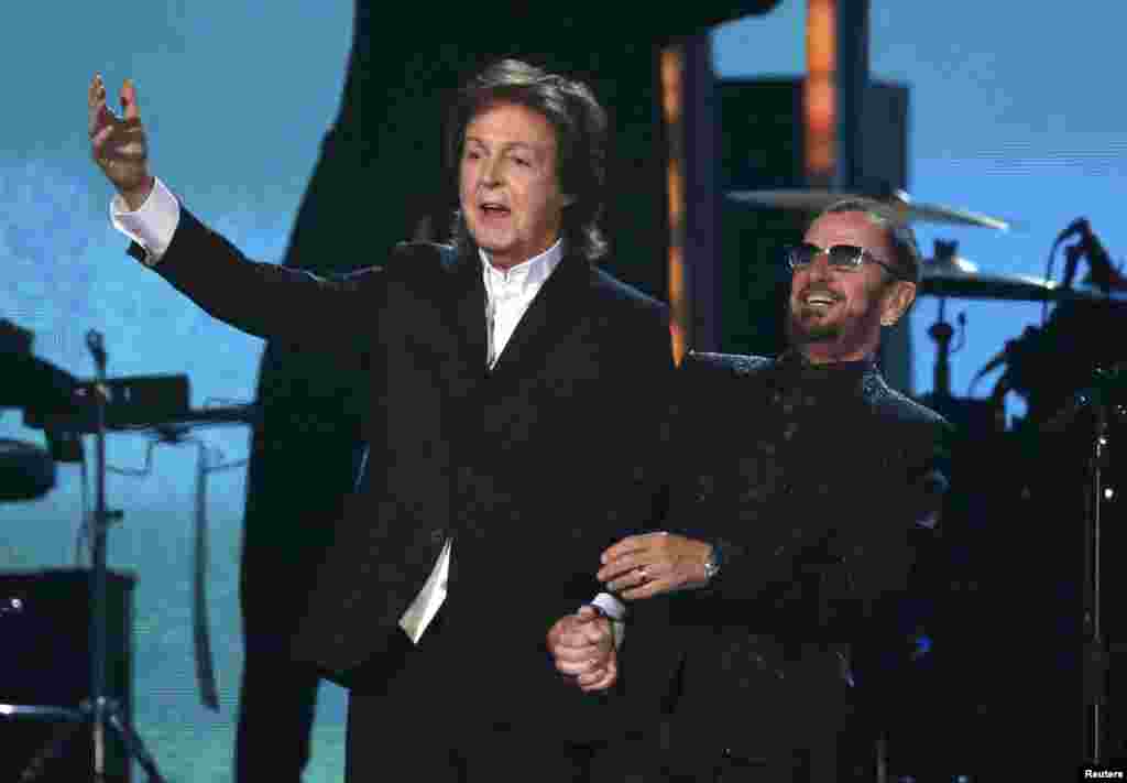 The only surviving former Beatles, Paul McCartney (left) and Ringo Starr, prepare to take a bow after performing together at the 56th annual Grammy Awards in Los Angeles. (Reuters/Mario Anzuoni)