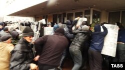 Pro-Russia protesters storm the mayor's office in Mariupol on April 13.