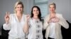 Using gestures that would later become iconic opposition symbols, Svatlana Tsikhanouskaya clenches her fist, Maryya Kalesnikava makes a heart sign, and Veranika Tsapkala signals V for victory while campaigning ahead of Belarus's disputed presidential election in 2020. 