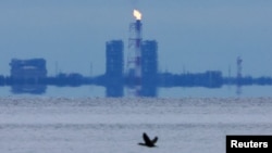Gas flares at a Nord Stream station on the coast of the Gulf of Finland in Russia's Leningrad Region.