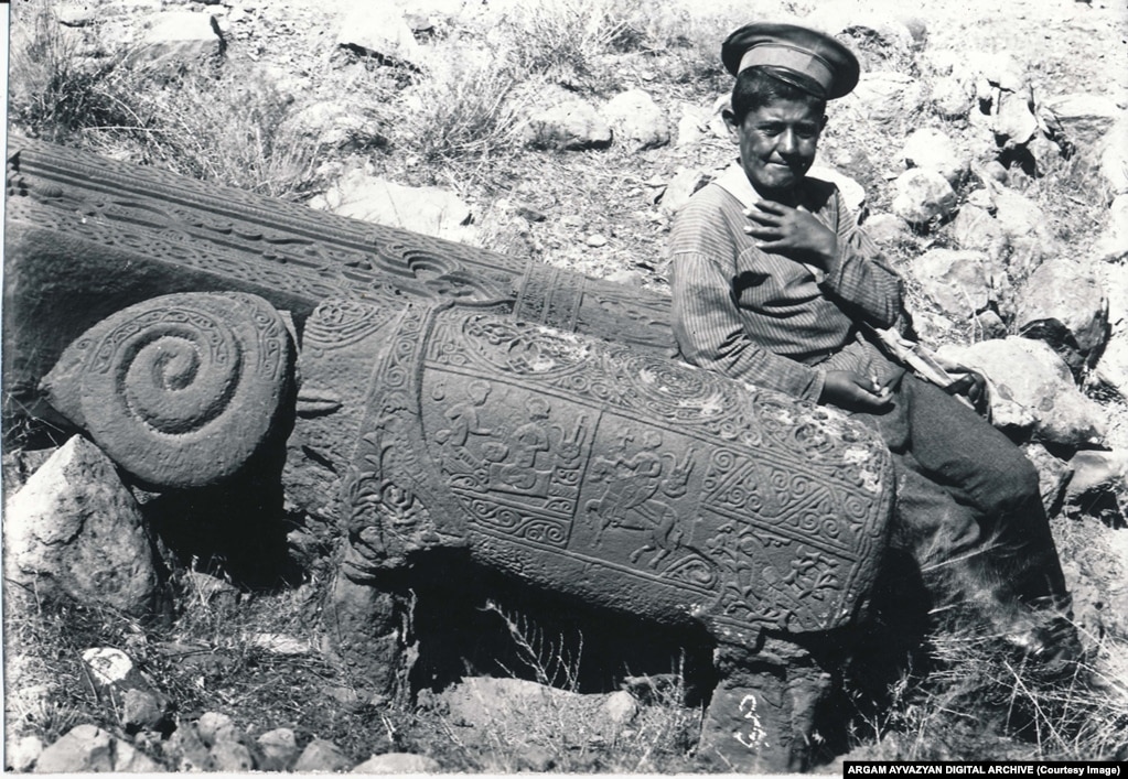 A boy poses next to one of Julfa’s rams in 1915.
