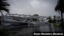 U.S. -- The crumbled canopy of a gas station damaged by Hurricane Irma is seen in Bonita Springs, Florida, September 10, 2017
