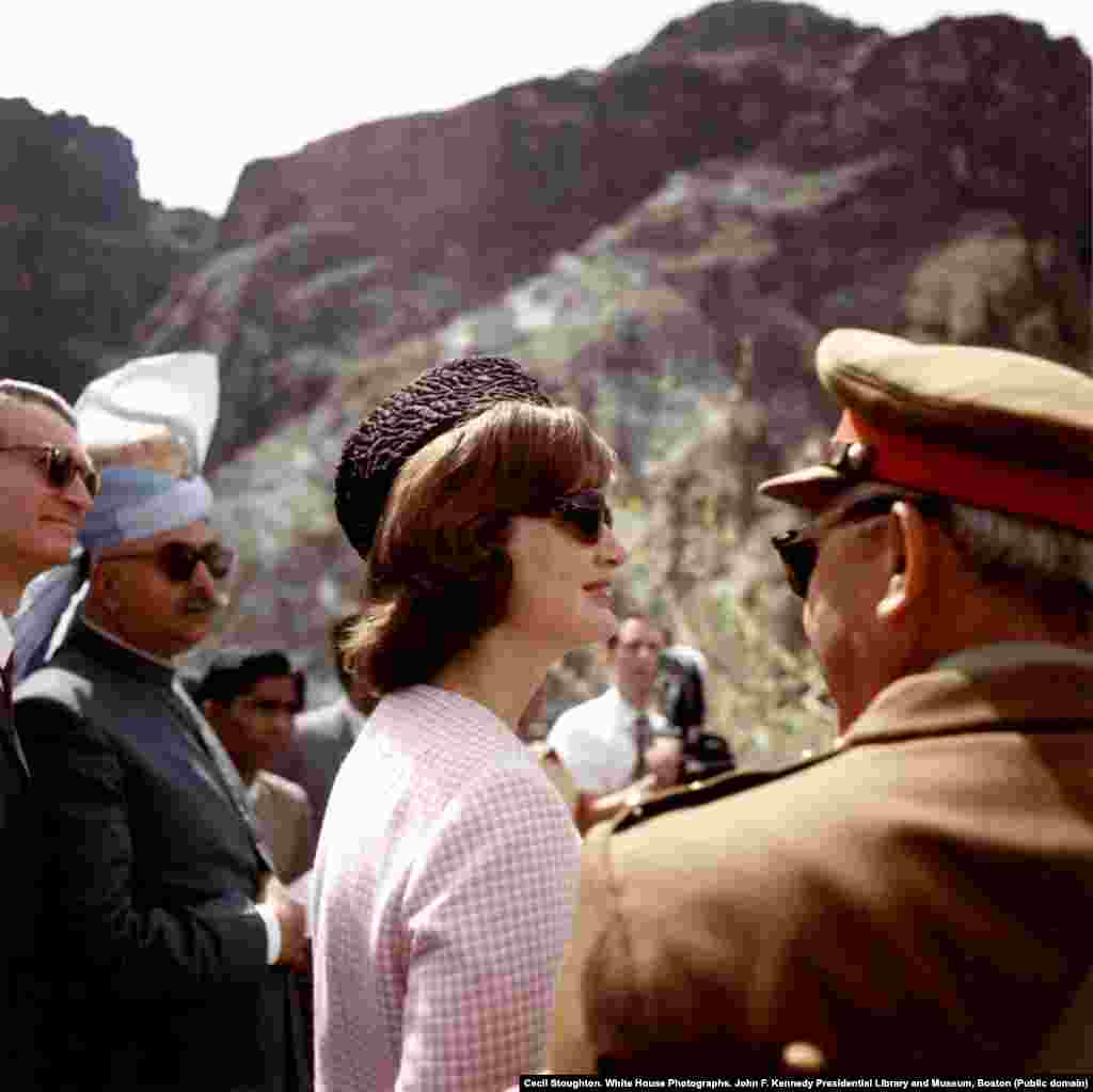 Jacqueline Kennedy in the Khyber Pass wearing a traditional karakul hat that President Khan had given to her. The trip was labeled a great success and was said to have marked some of the happiest days Kennedy spent as first lady. A year later her husband, President John F. Kennedy, was shot dead as she rode with him in a motorcade in Dallas.