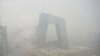 The CCTV tower in Beijing shrouded in smog.