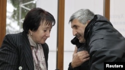 Presidential candidate Alla Dzhioyeva (left) meets with the head of the breakaway region of South Ossetia's Interior Ministry, Valery Valiev, on November 28.