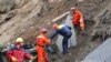 Armenia - A rescue team works at the site of a major landslide in northern Tavush region, 3Oct2011.