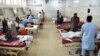 The injured receive treatment at a hospital following a suicide attack in Jalalabad on June 11.