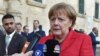 Меркель закликала Путіна припинити насильство на Донбасі