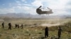 FILE: U.S. military Chinook helicopter lands on a field outside the governor's palace in Maidan Shar, the capital of Wardak Province.